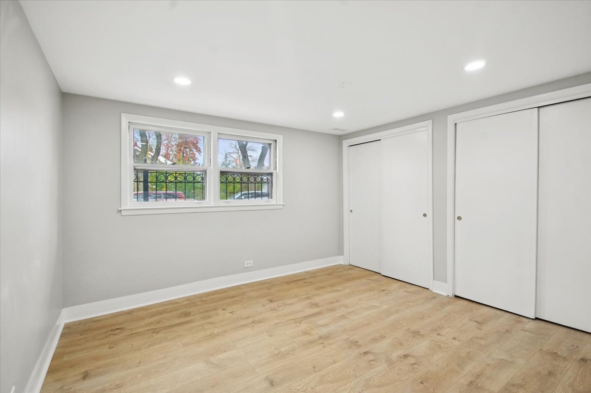 2623 West Arthur Avenue, Unit 1 Chicago, IL 60645 - Photo 7 of 11 a view of an empty room with a window