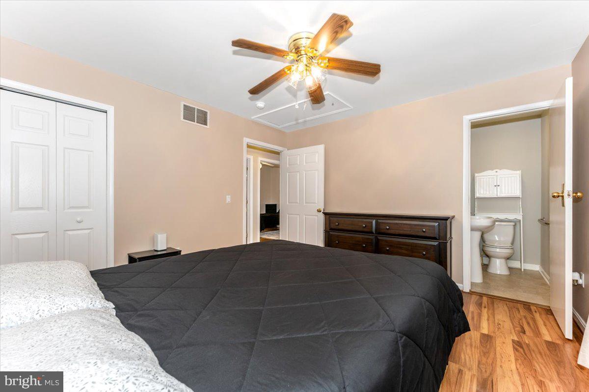 8109 Beverly Road Severn, MD 21144 - Photo 16 of 43 a bedroom with a bed and closet