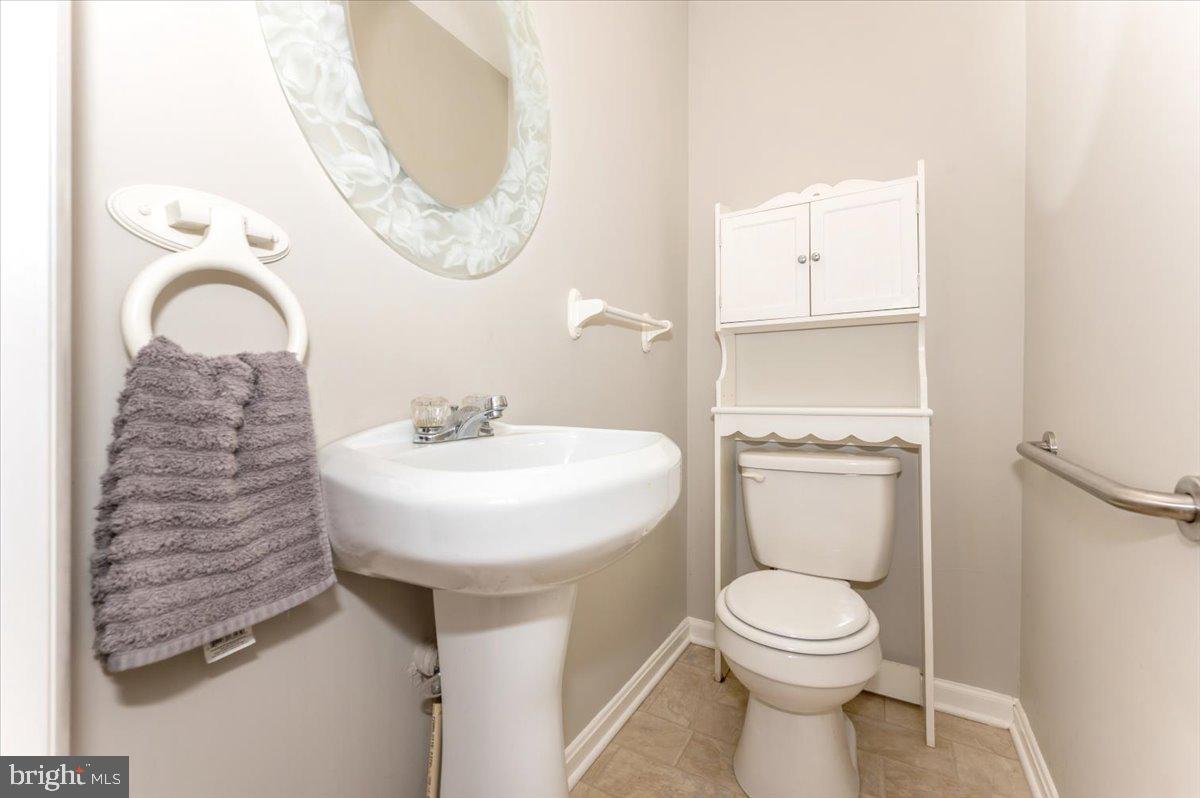 8109 Beverly Road Severn, MD 21144 - Photo 17 of 43 a bathroom with a sink and a mirror
