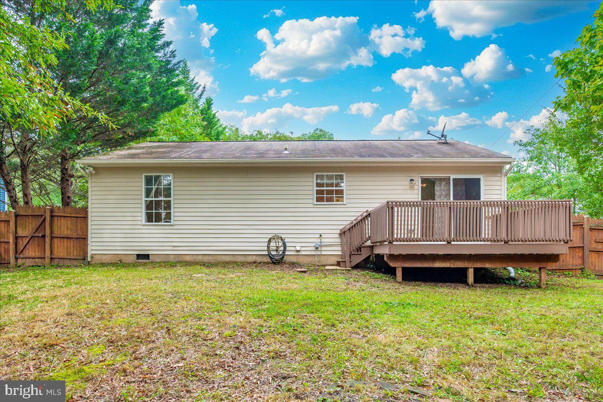 8109 Beverly Road Severn, MD 21144 - Photo 26 of 43 a front view of a house with a garden and deck