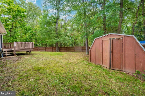a view of a backyard with sitting area