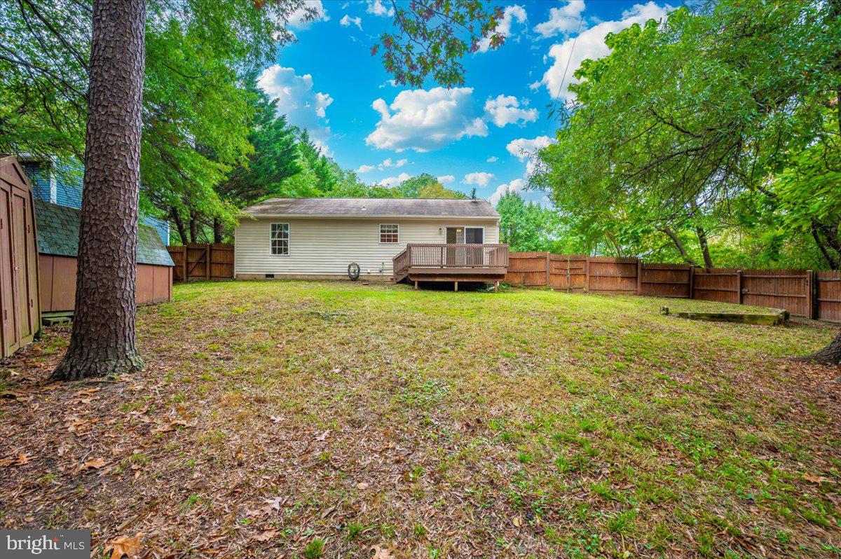 8109 Beverly Road Severn, MD 21144 - Photo 35 of 43 a view of a house with a yard and sitting area