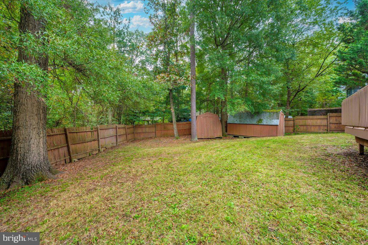 8109 Beverly Road Severn, MD 21144 - Photo 37 of 43 a backyard of a house with lots of green space