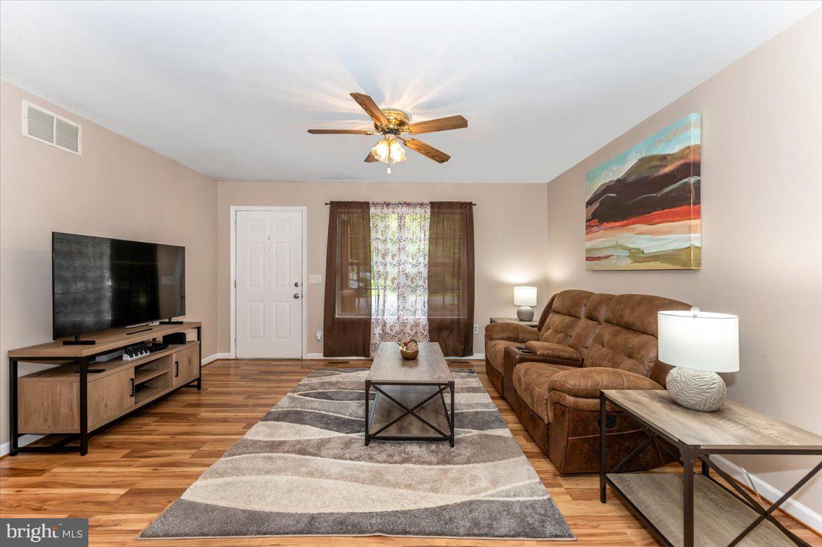 8109 Beverly Road Severn, MD 21144 - Photo 4 of 43 a living room with furniture and a flat screen tv