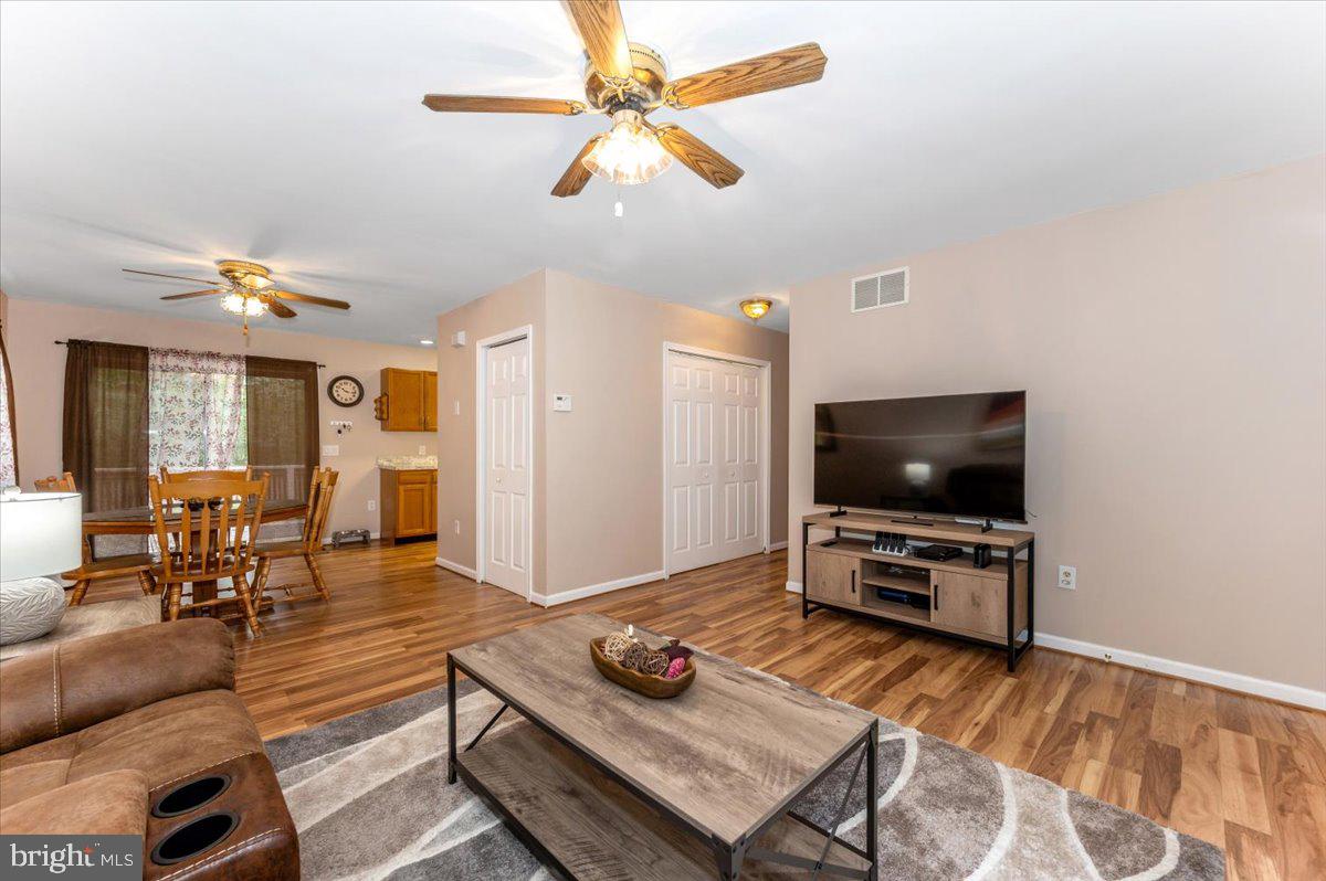 8109 Beverly Road Severn, MD 21144 - Photo 7 of 43 a living room with furniture and a flat screen tv