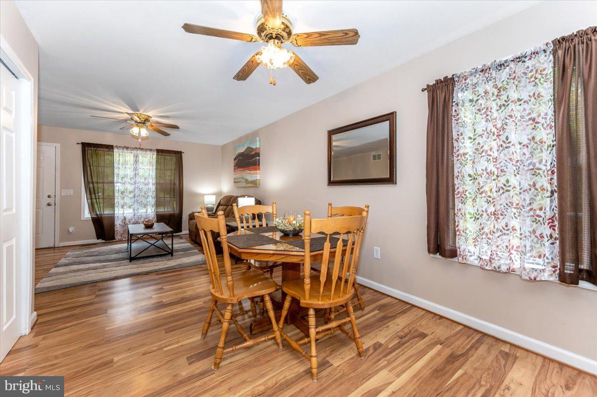 8109 Beverly Road Severn, MD 21144 - Photo 10 of 43 a view of a dining room with furniture and a chandelier