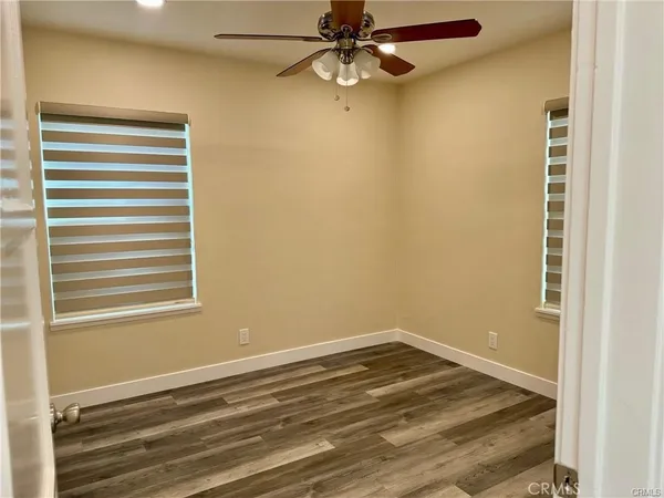 a view of a room with a air conditioner and a window