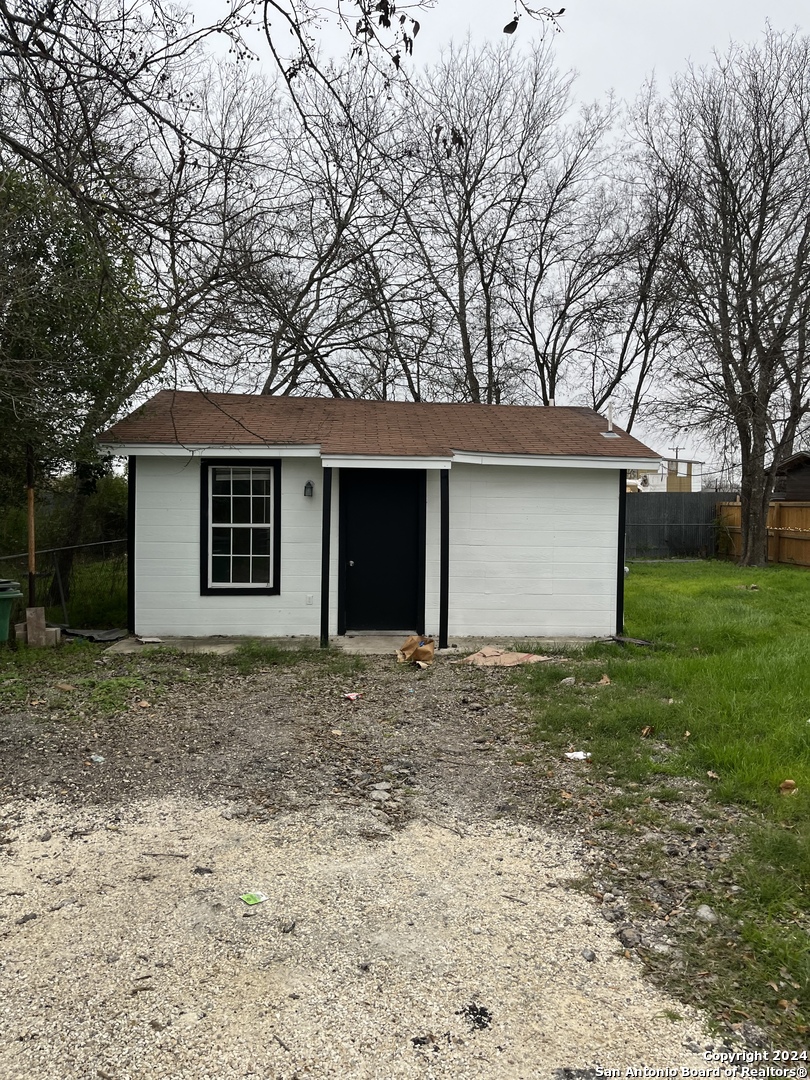 136 Hilary Street, Unit 2 San Antonio, TX 78210 - Photo 1 of 4 a front view of a house with a garden and yard