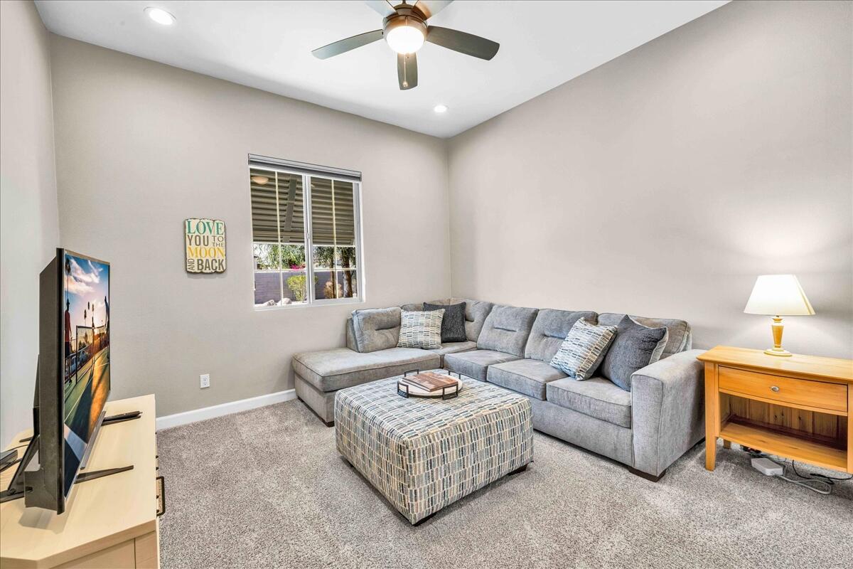 72 Barolo Rancho Mirage, CA 92270 - Photo 20 of 65 a living room with furniture and a flat screen tv