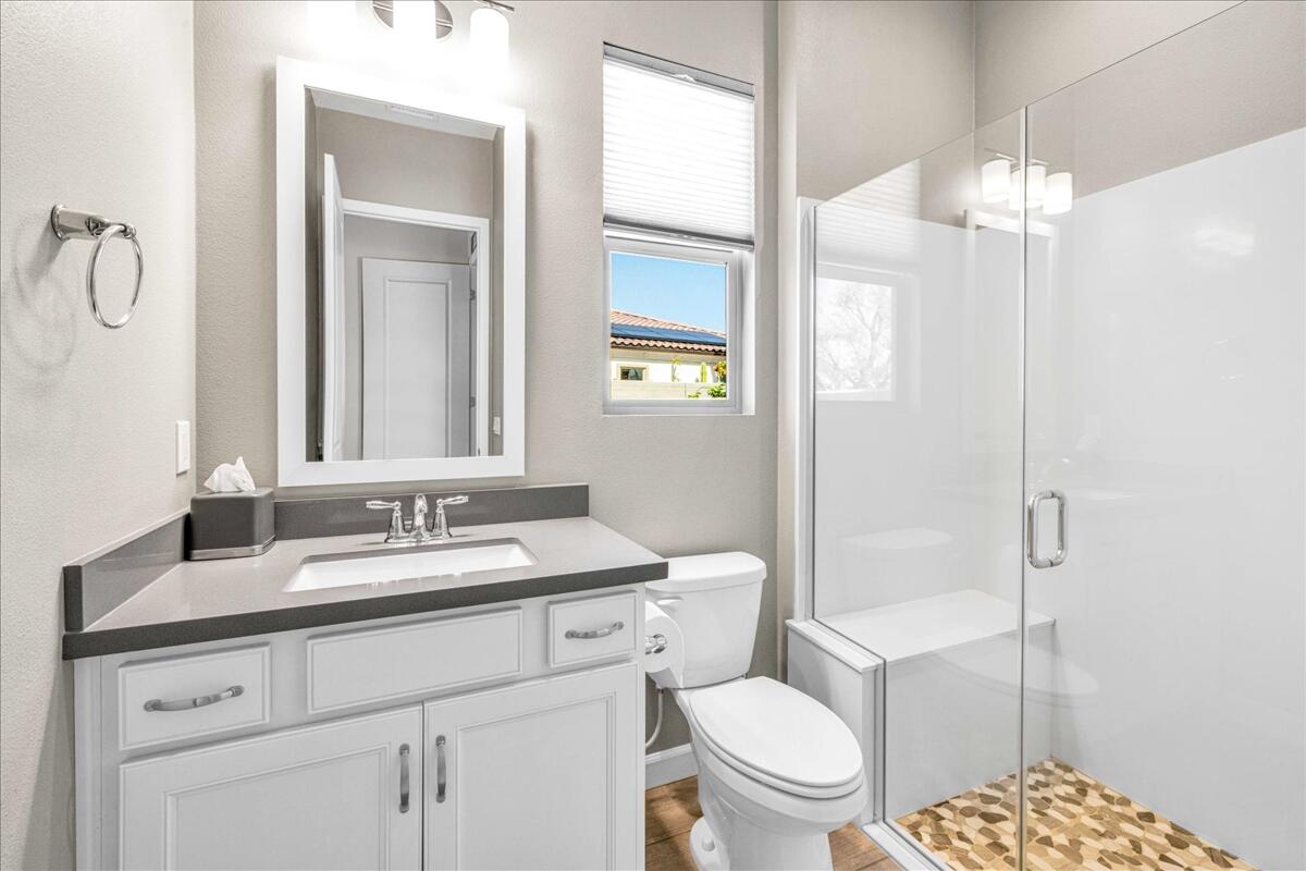 72 Barolo Rancho Mirage, CA 92270 - Photo 22 of 65 a bathroom with a granite countertop toilet sink and mirror