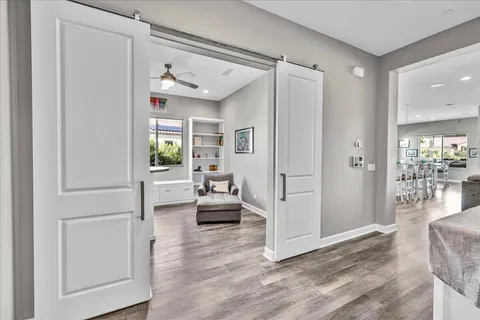 a view of a swimming pool with outdoor seating