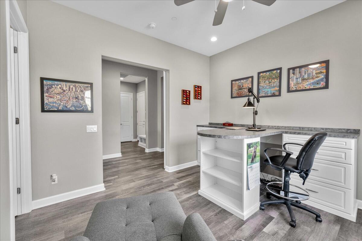 72 Barolo Rancho Mirage, CA 92270 - Photo 25 of 65 a workspace with furniture and wooden floor