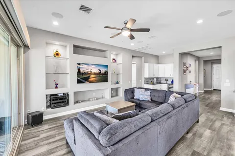 a view of a house with a backyard