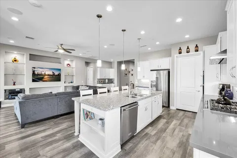 a view of a swimming pool with outdoor seating