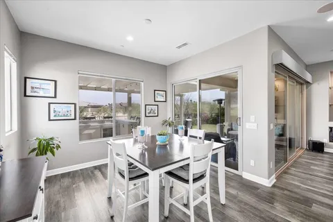 a view of a porch with furniture and garden