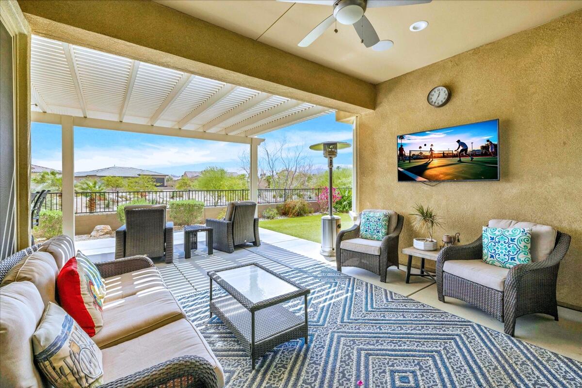 72 Barolo Rancho Mirage, CA 92270 - Photo 7 of 65 a living room with patio furniture and a flat screen tv