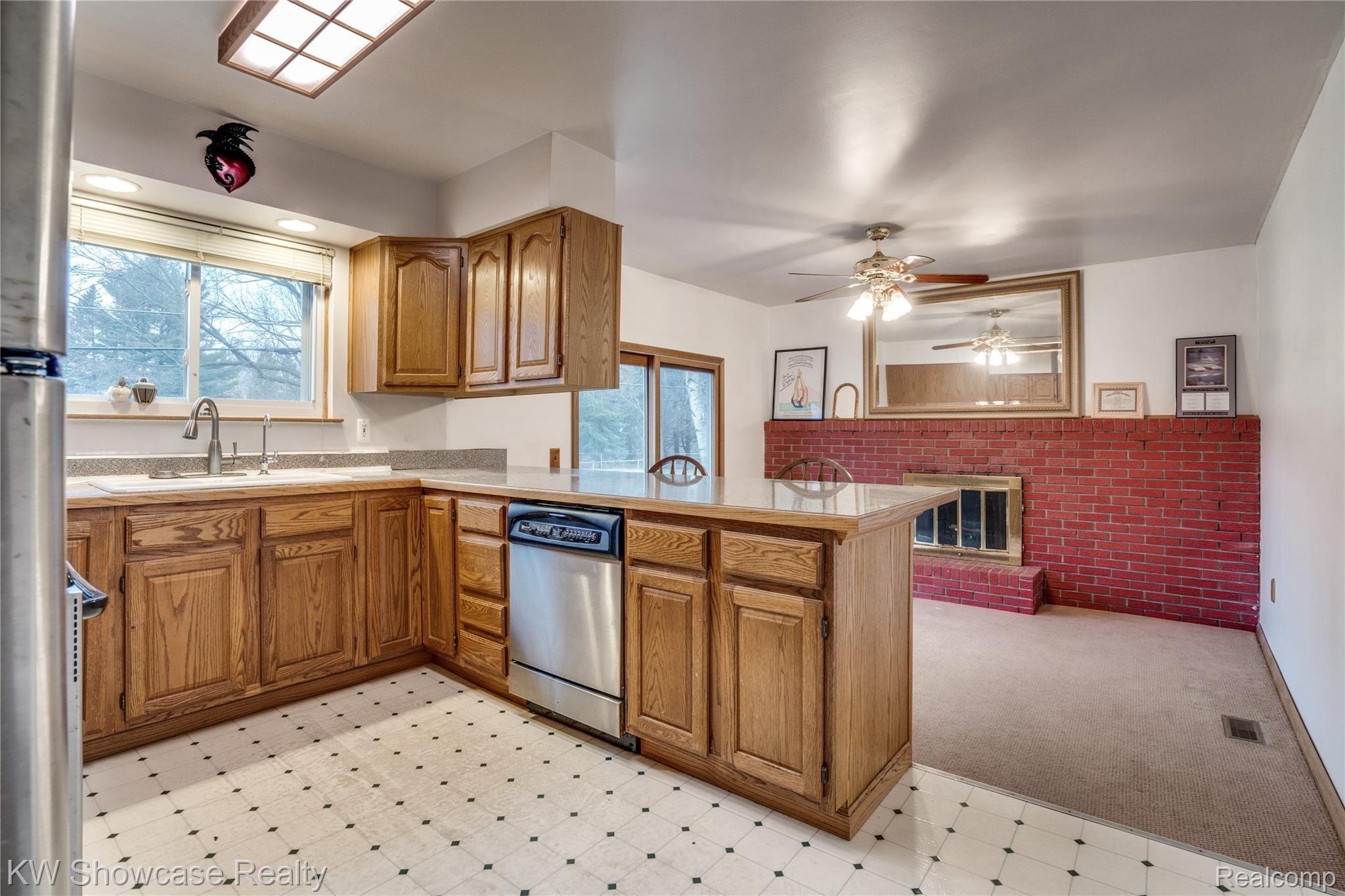 2129 Welch Road Walled Lake, MI 48390 - Photo 12 of 26 The Kitchen and Living Room are connected.