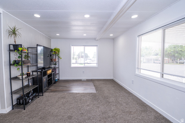 2600 North Hill Field Road, Unit 5 Layton, UT 84041 - Photo 5 of 33 Spacious room featuring recessed lighting, a combination of carpet and wood-finish flooring, and multiple windows with horizontal blinds