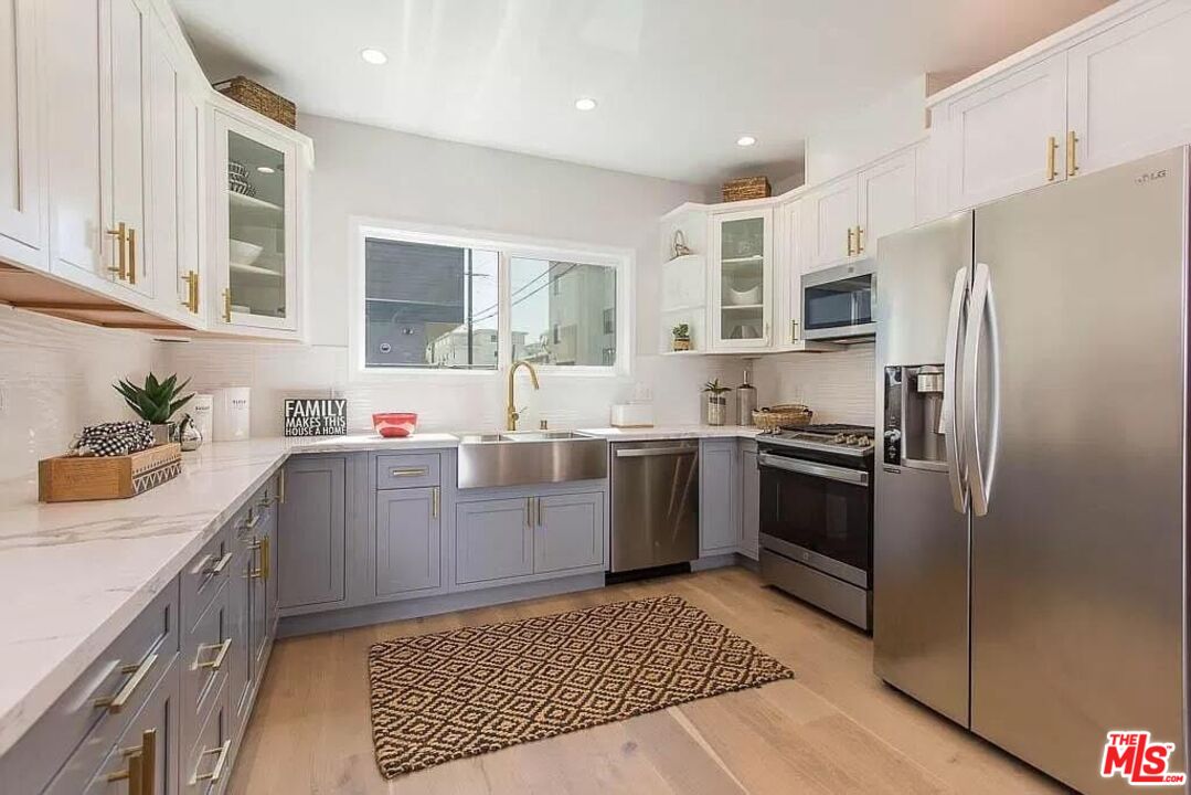 2419 Walnut Avenue Venice, CA 90291 - Photo 4 of 11 a kitchen with a sink stove and refrigerator