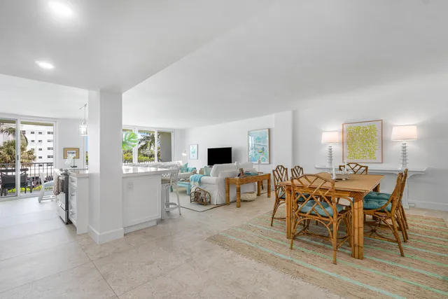 a view of a dining room with furniture and a window