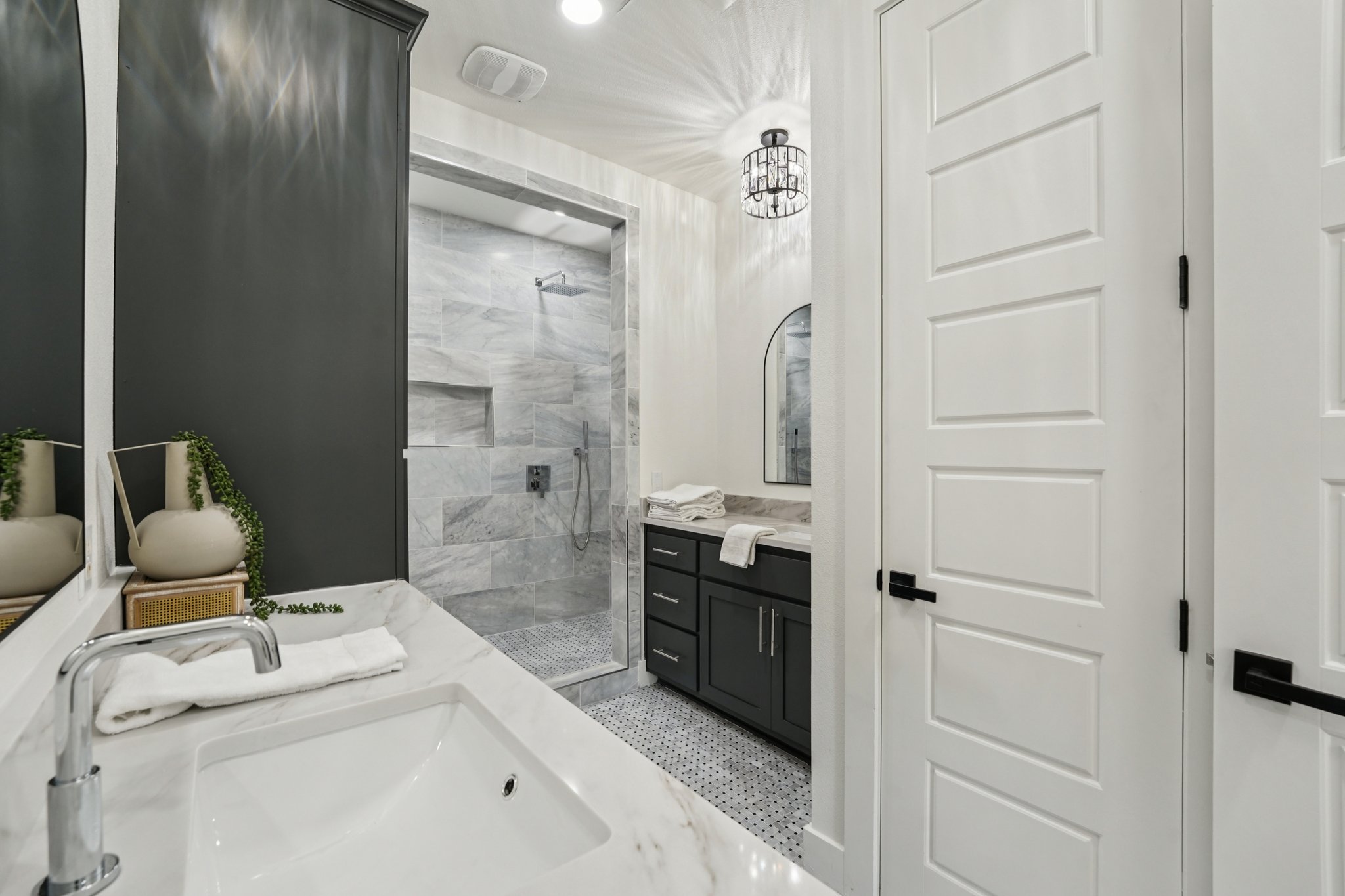 2811 Zach Scott Street Austin, TX 78723 - Photo 23 of 37 Bathroom featuring a stall shower, two vanities, and recessed lighting