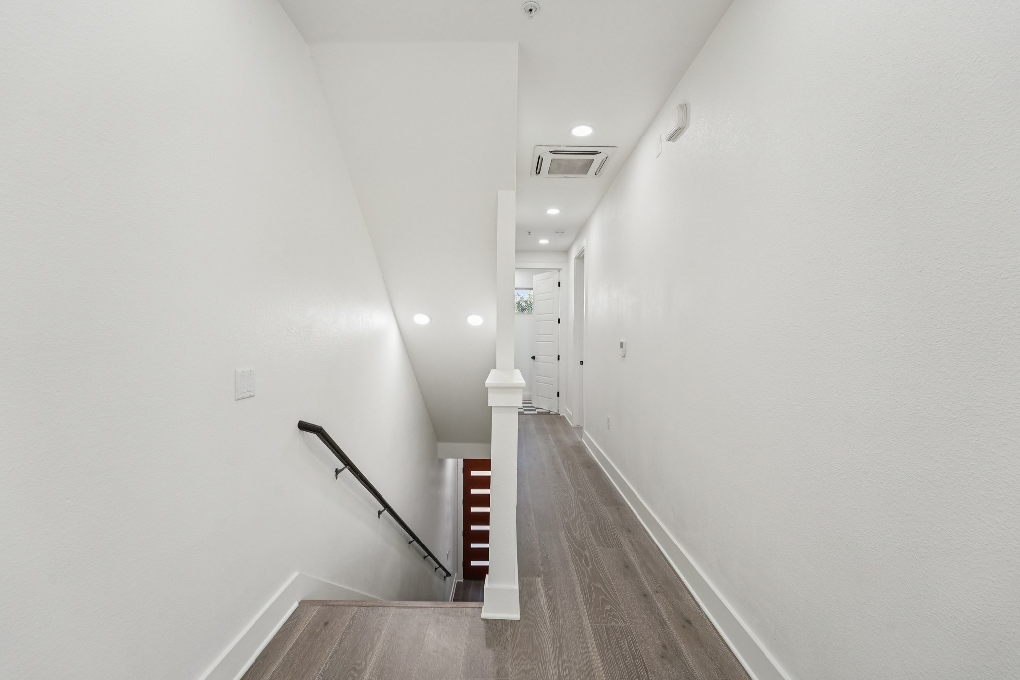2811 Zach Scott Street Austin, TX 78723 - Photo 24 of 37 Staircase with wood finished floors and recessed lighting