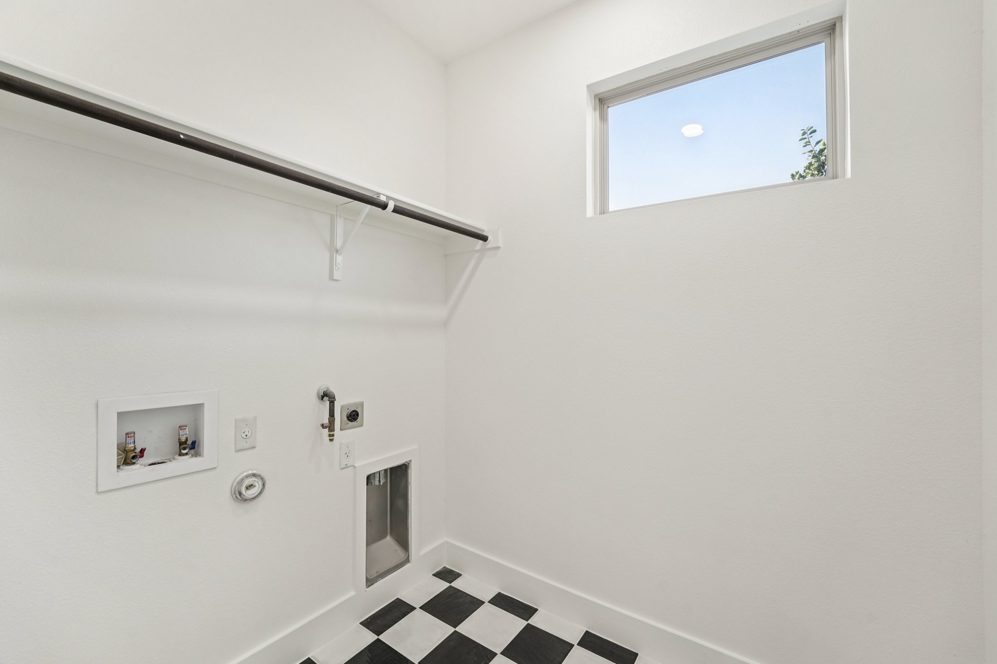 2811 Zach Scott Street Austin, TX 78723 - Photo 25 of 37 Laundry room featuring gas dryer hookup, hookup for a washing machine, electric dryer hookup, and tile patterned floors
