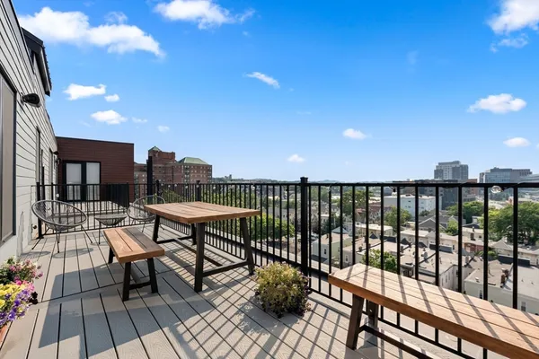 a view of a balcony with chairs
