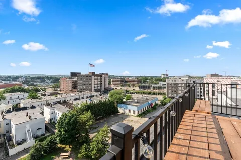 a view of a balcony with city view