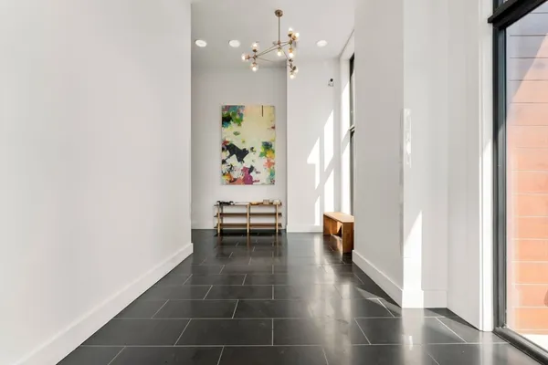 wooden floor in an empty room and a window
