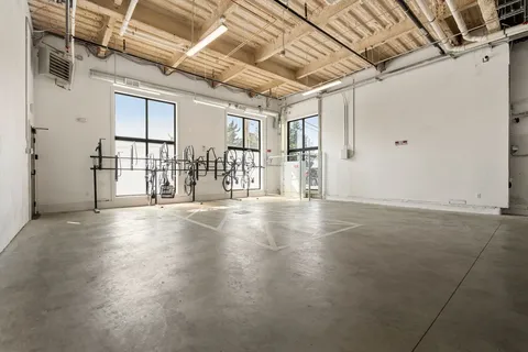 a view of a livingroom with wooden floor