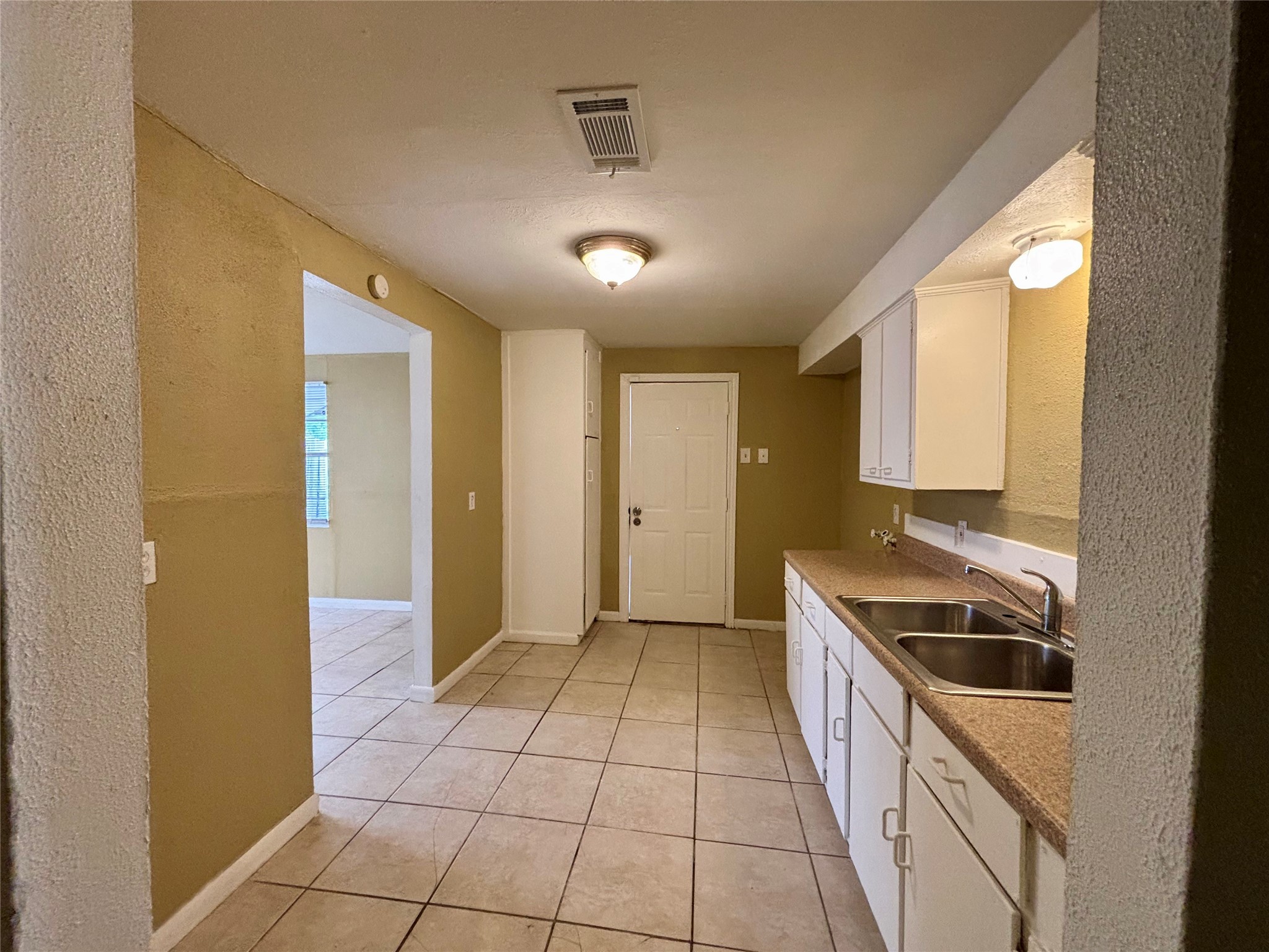 3902 Heatherbloom Drive Houston, TX 77045 - Photo 2 of 17 a view of a kitchen with a sink and cabinets