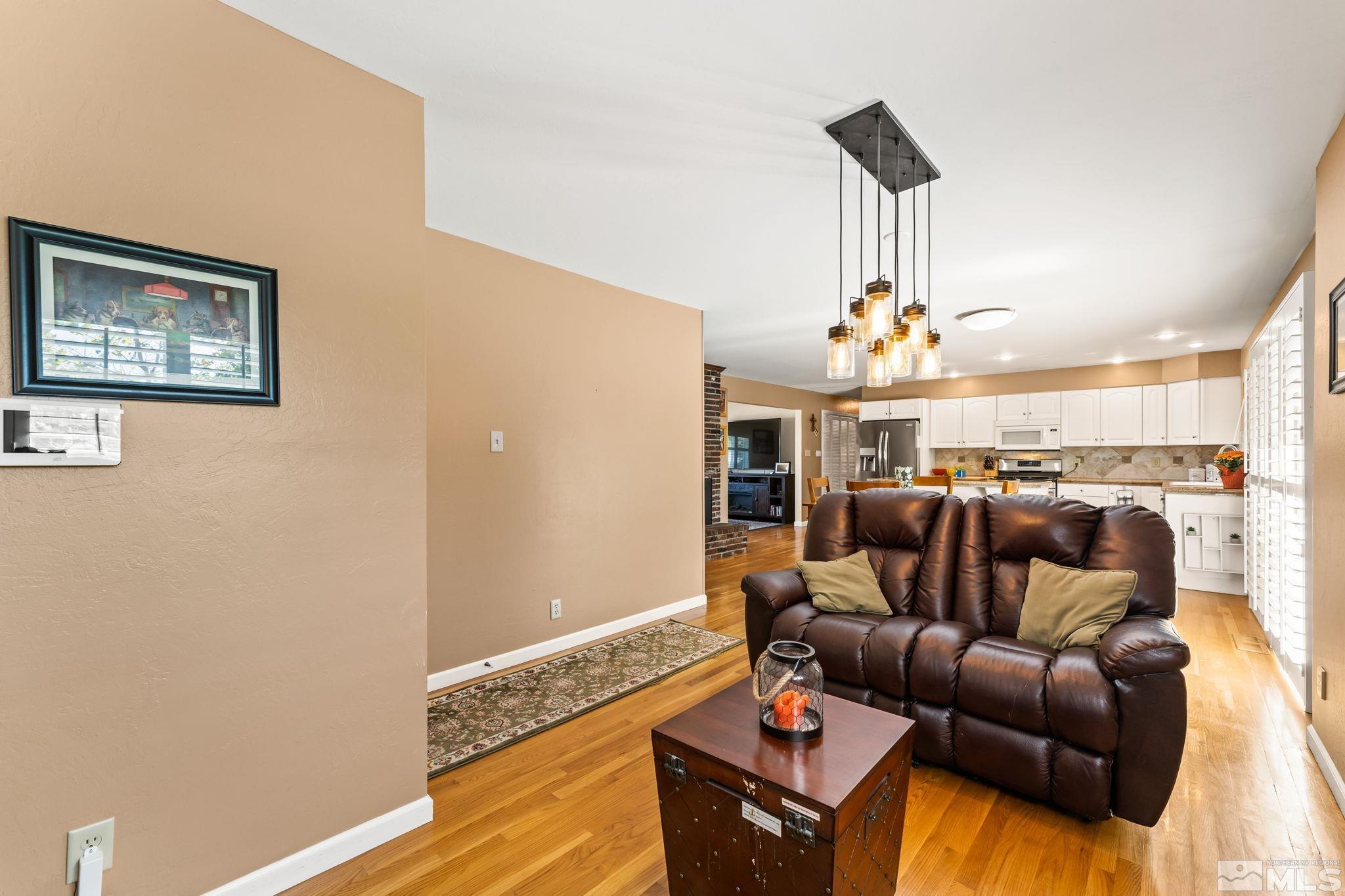 1070 Pineridge Drive Reno, NV 89509 - Photo 12 of 24 a living room with furniture and wooden floor