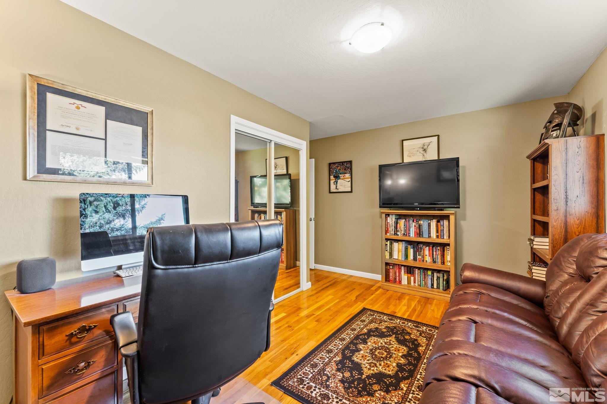1070 Pineridge Drive Reno, NV 89509 - Photo 18 of 24 a living room with furniture and a flat screen tv