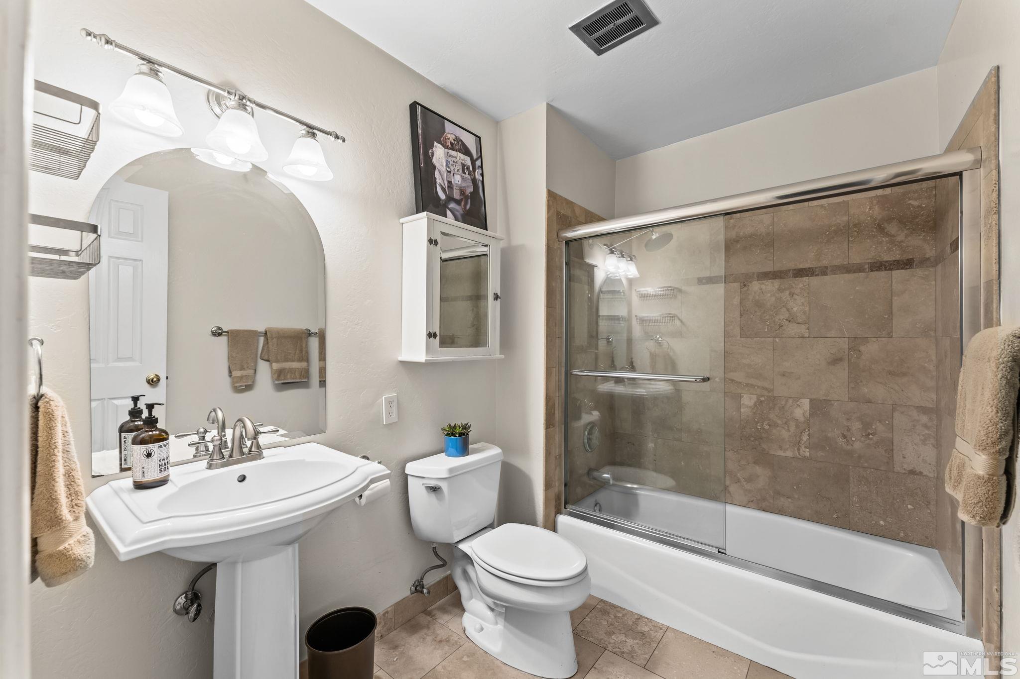 1070 Pineridge Drive Reno, NV 89509 - Photo 19 of 24 a bathroom with a sink toilet and shower