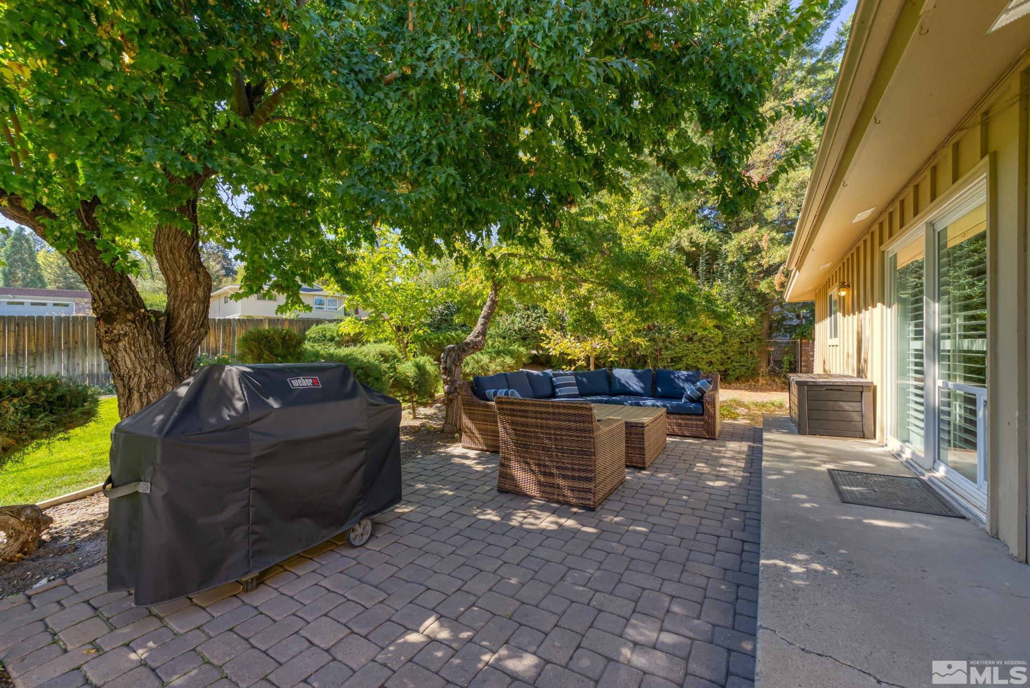 1070 Pineridge Drive Reno, NV 89509 - Photo 22 of 24 a view of a backyard with sitting area