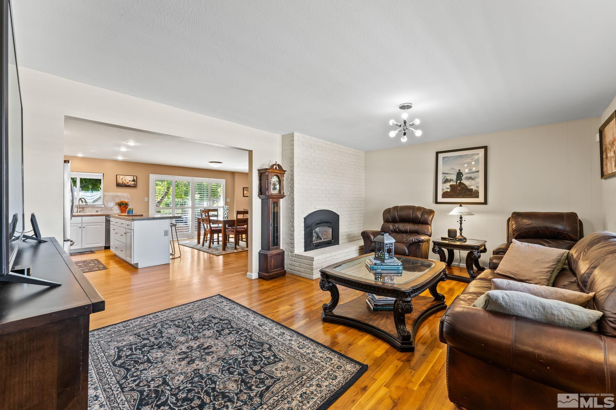 1070 Pineridge Drive Reno, NV 89509 - Photo 3 of 24 a living room with furniture and a dining table