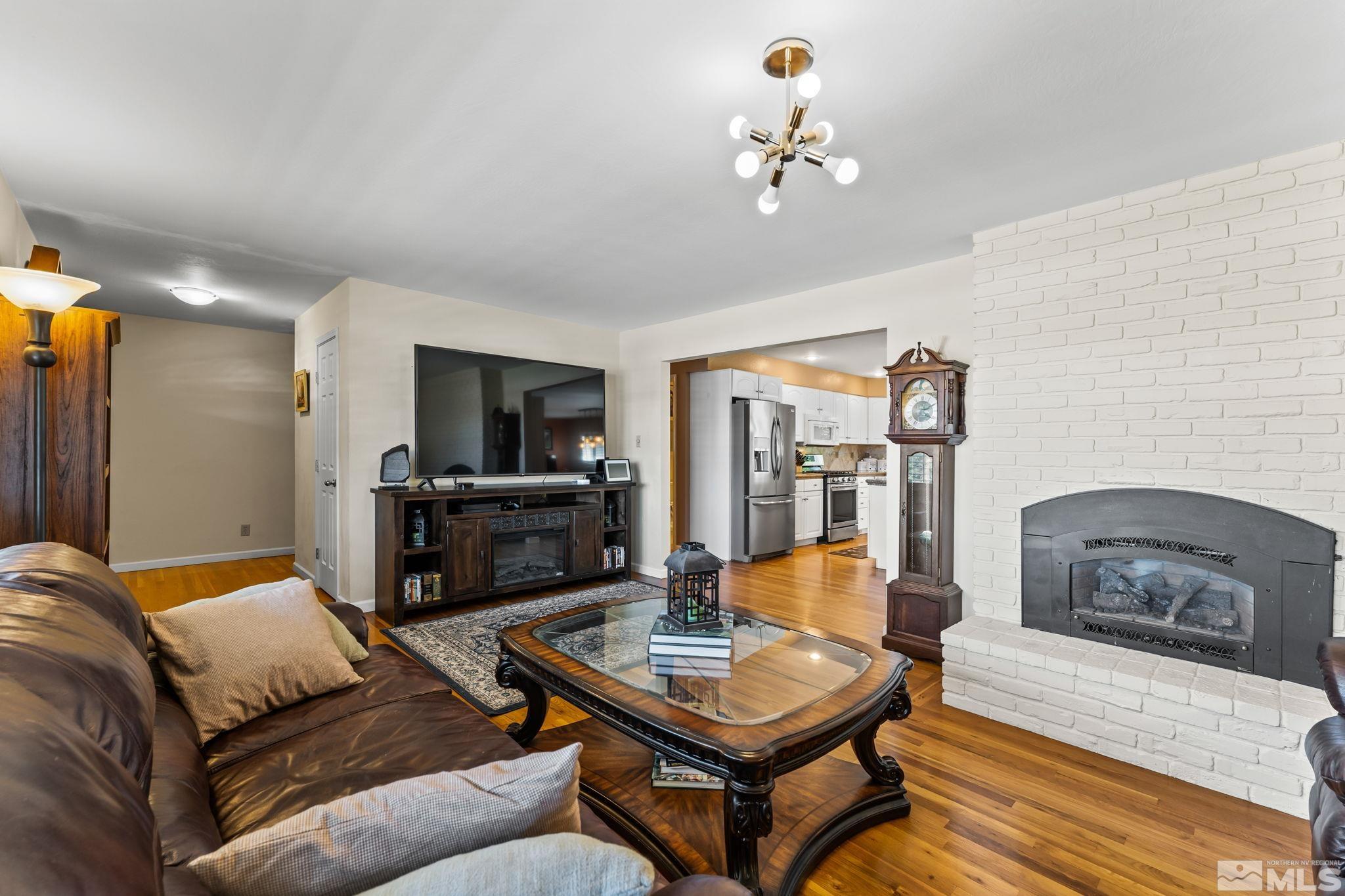 1070 Pineridge Drive Reno, NV 89509 - Photo 5 of 24 a living room with furniture and a flat screen tv