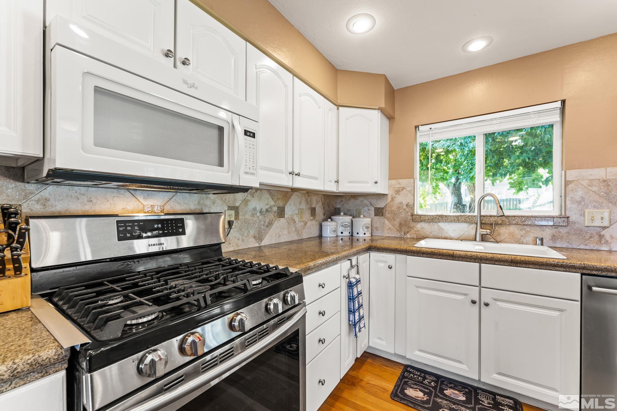 1070 Pineridge Drive Reno, NV 89509 - Photo 9 of 24 a kitchen with appliances cabinets and a sink