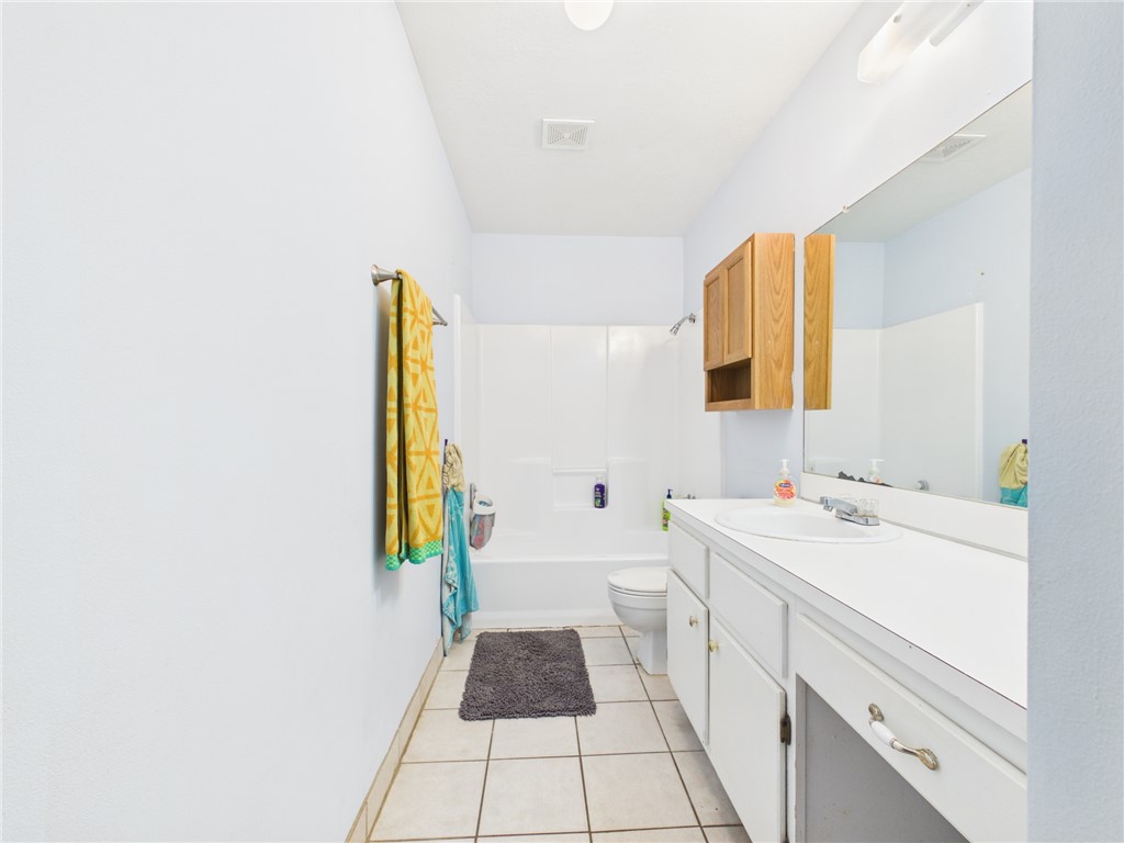 800 Rio Grande Lane Bryan, TX 77801 - Photo 10 of 23 a bathroom with a sink and a bathtub