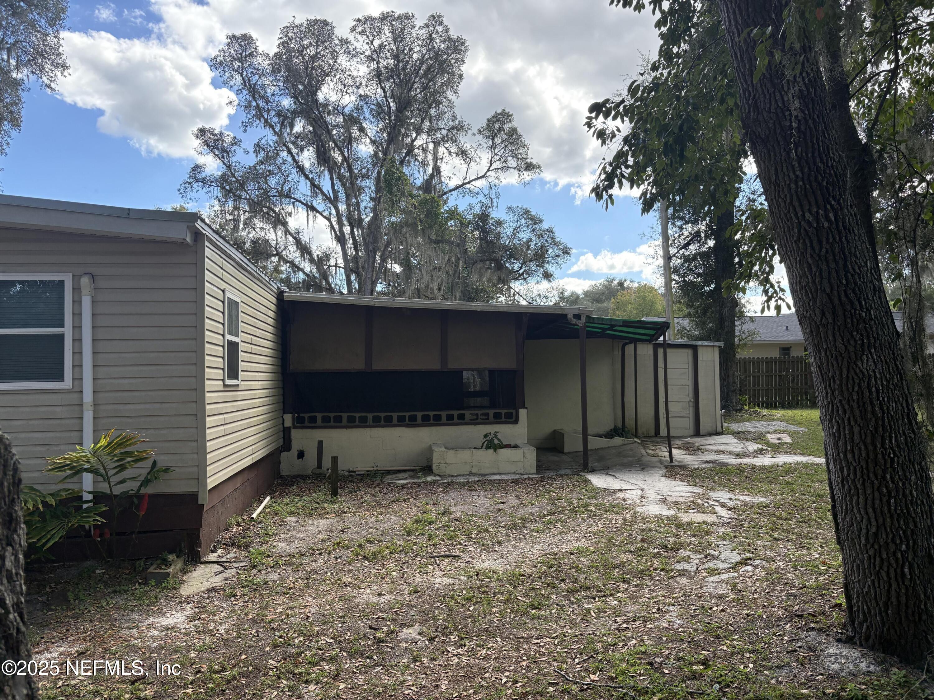 271 Heidt Road Palatka, FL 32177 - Photo 3 of 21 a backyard of a house with barbeque oven and outdoor seating