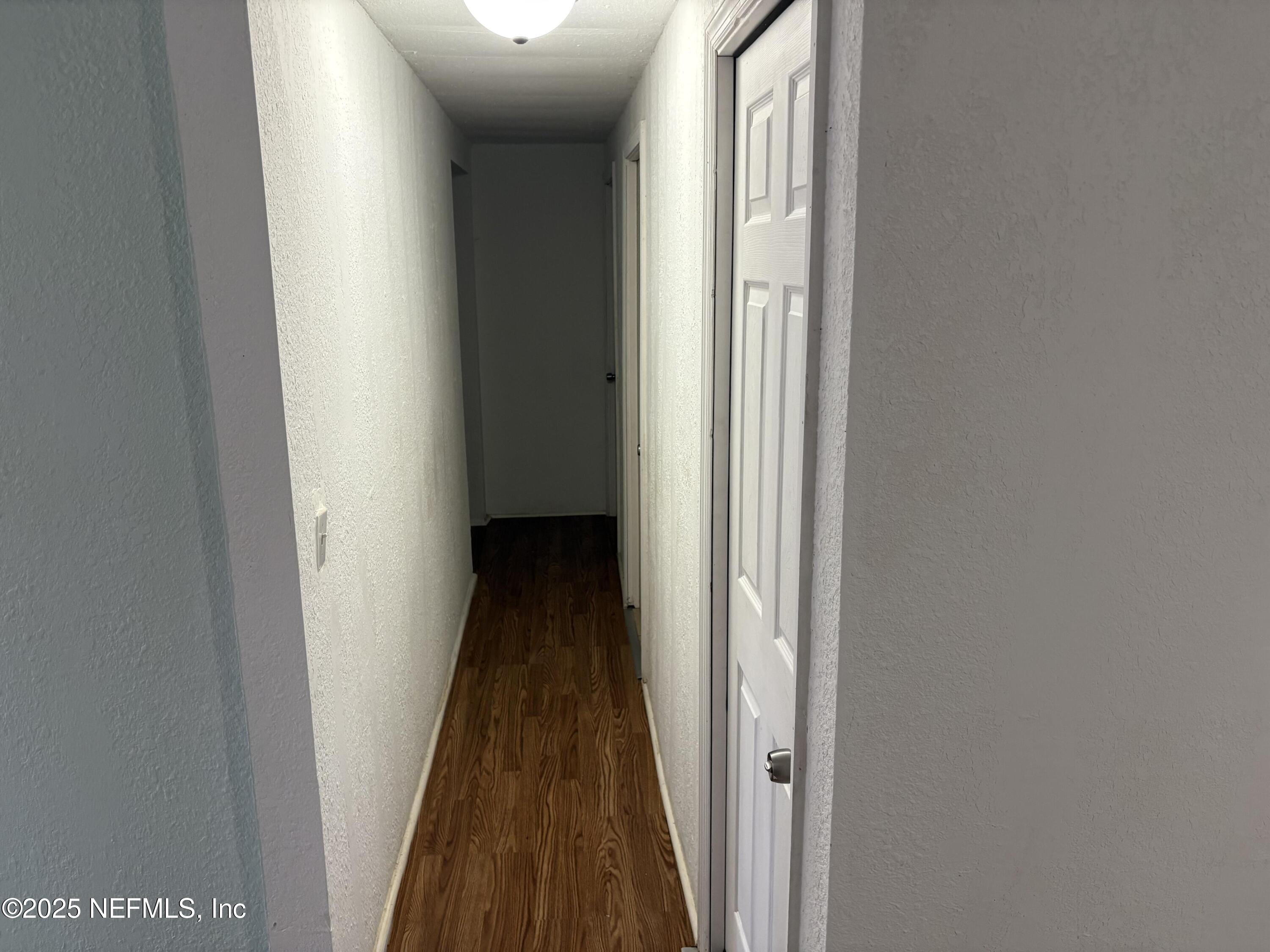 271 Heidt Road Palatka, FL 32177 - Photo 10 of 21 a view of a hallway with a hardwood floor
