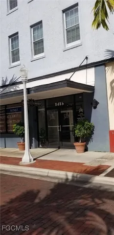 a kitchen with stainless steel appliances granite countertop a refrigerator a sink a stove a microwave and cabinets