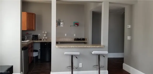 a kitchen with a refrigerator and a stove