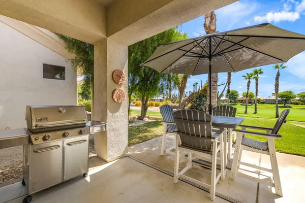 a view of an chairs and tables in the patio