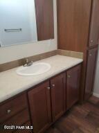 375 West Antelope Run Road Paulden, AZ 86334 - Photo 8 of 13 a bathroom with a sink vanity and a mirror