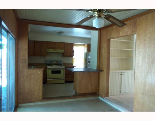626 Vaky Street Corpus Christi, TX 78404 - Photo 3 of 7 a kitchen with kitchen island a sink stainless steel appliances and cabinets