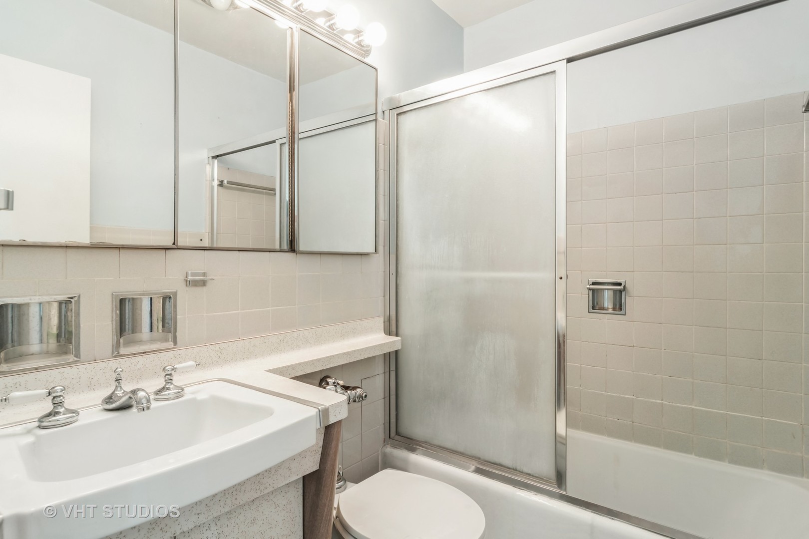 3900 North Lake Shore Drive, Unit 9J Chicago, IL 60613 - Photo 13 of 18 a bathroom with a sink toilet and shower
