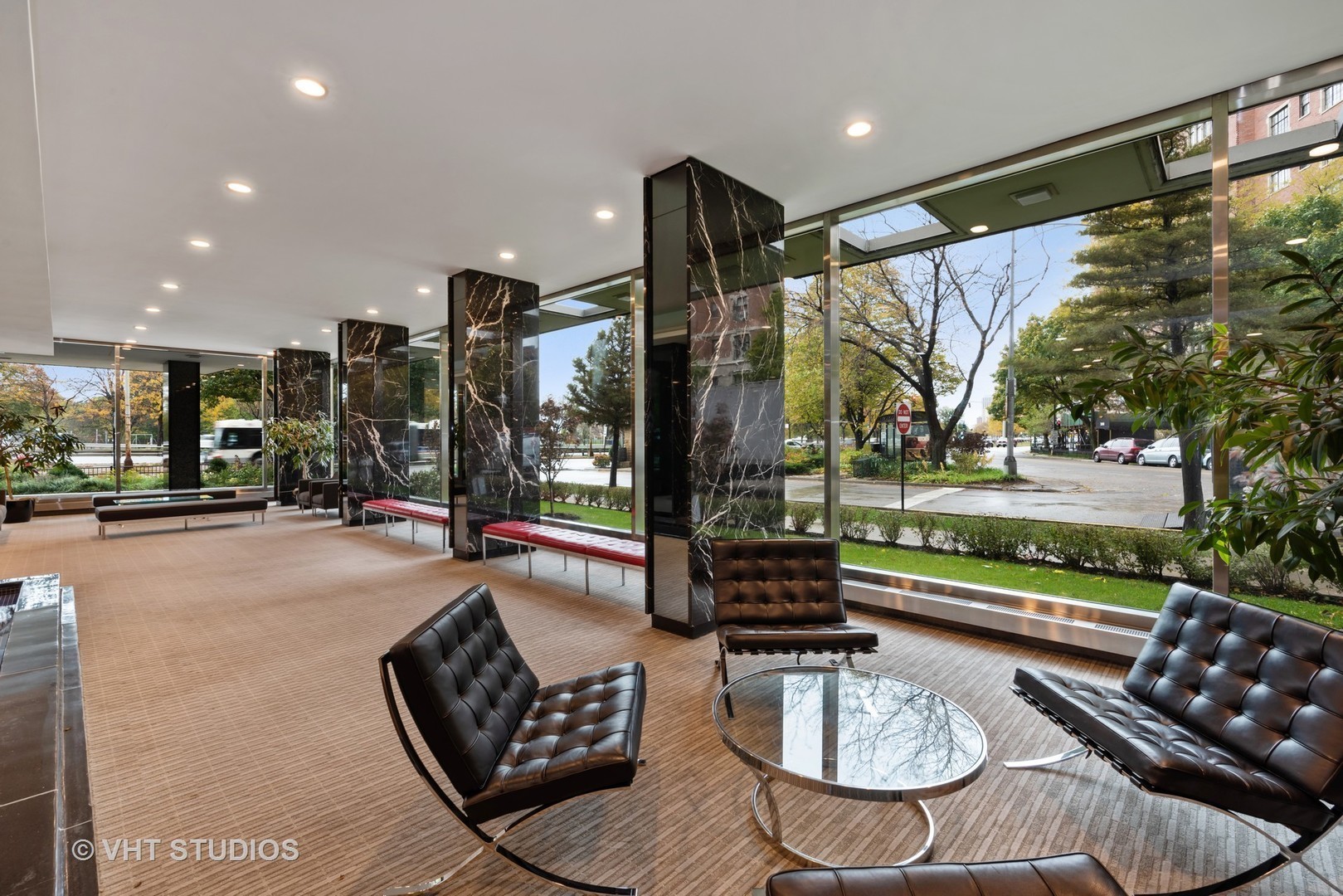 3900 North Lake Shore Drive, Unit 9J Chicago, IL 60613 - Photo 16 of 18 a living room with furniture and a floor to ceiling window