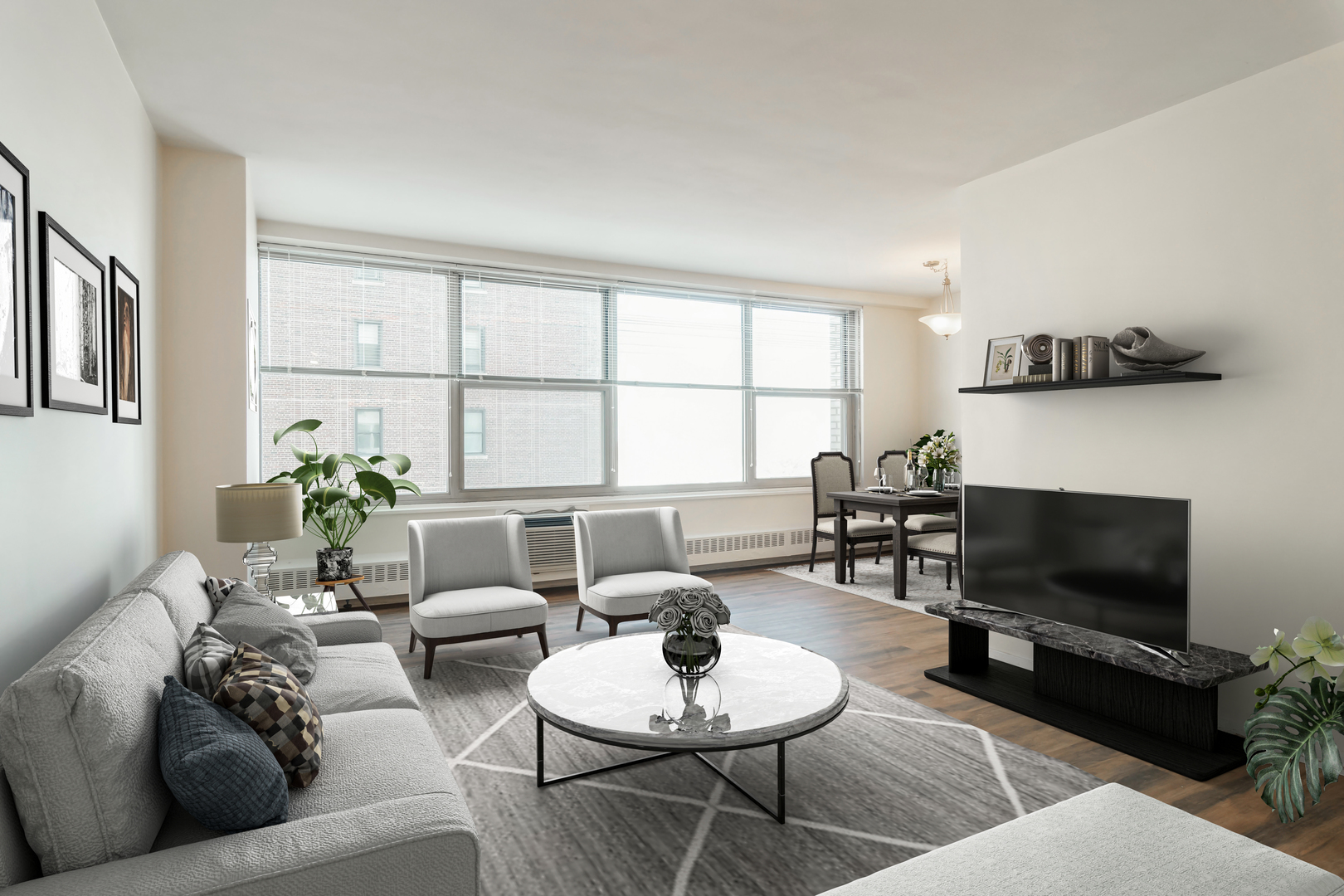 3900 North Lake Shore Drive, Unit 9J Chicago, IL 60613 - Photo 4 of 18 a living room with furniture a flat screen tv and a fireplace